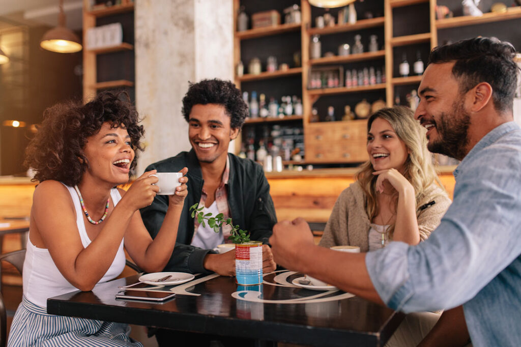 Young friends having a great time in restaurant