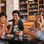 Young friends having a great time in restaurant