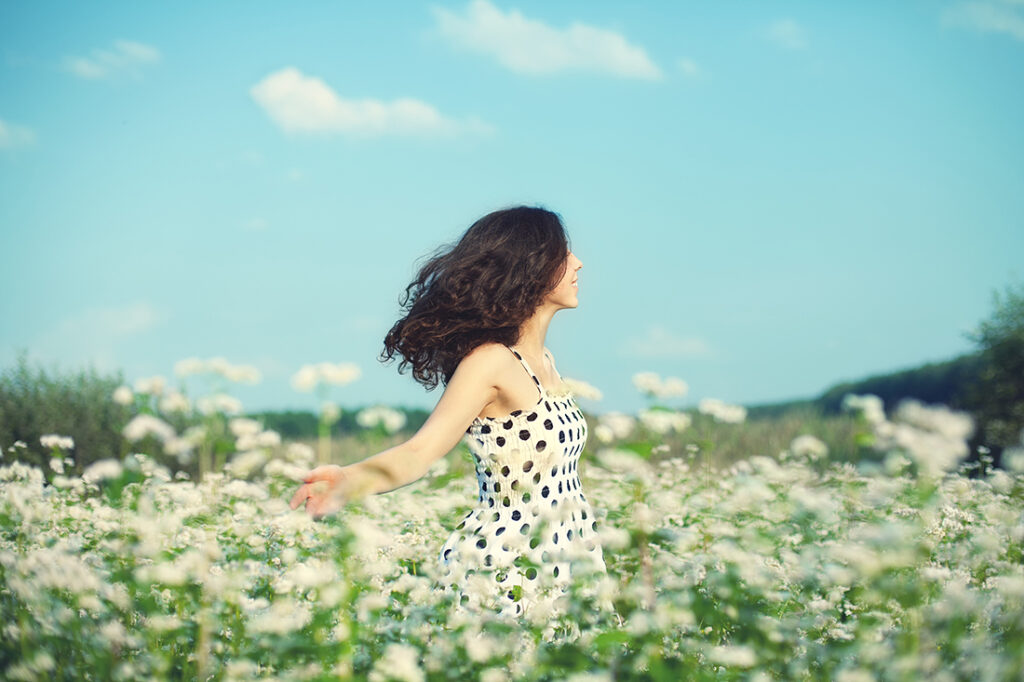 Young happy girl celebrating the beginning of springtime and April