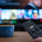 Remote control and television with documentaries on screen