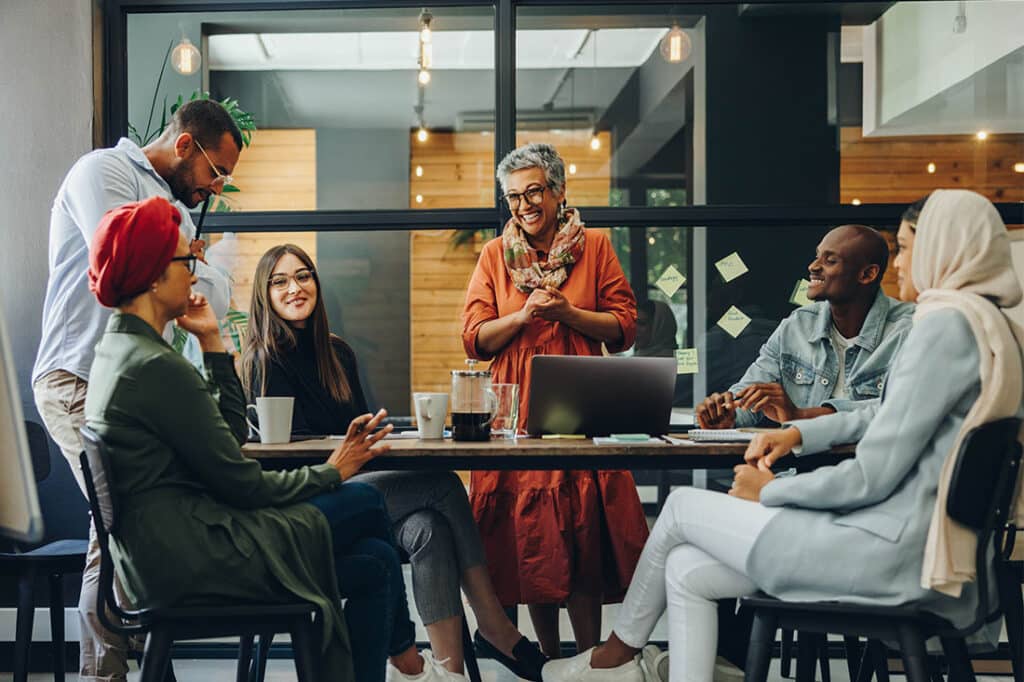 Group of business professionals working as a team in a diverse workplace
