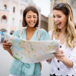 two women enjoy traveling together
