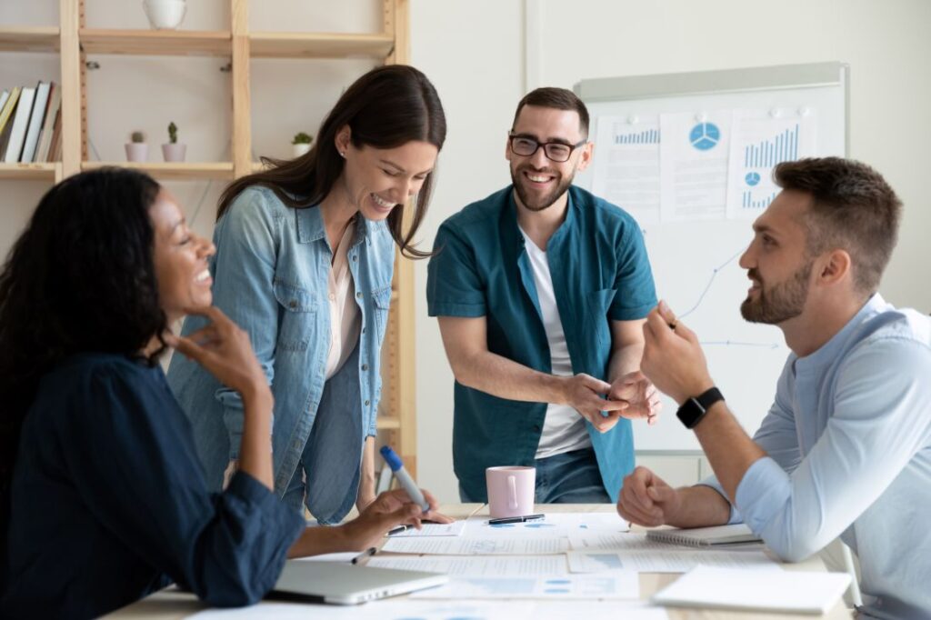 A group of coworkers chatting at a table