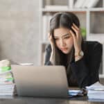woman hard working overwhelmed by procrastination