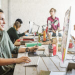 A female employee listens to music in the workplace