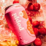 pink 12 oz can of Poppi Prebiotic Soda Raspberry Rose