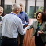 Professionals networking at an event