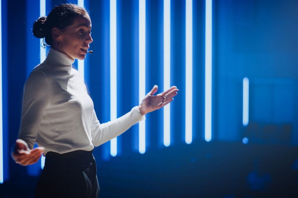 A female speaker on stage